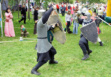 MOSCOW - SEPTEMBER 4: Medieval soldiers compete in battle on fight reconstruction on a holiday...