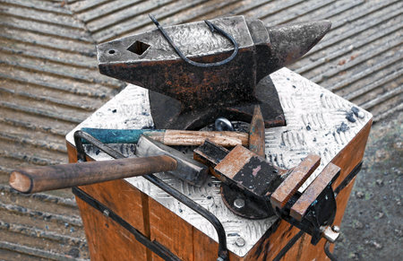 Forge tools on an anvilの写真素材