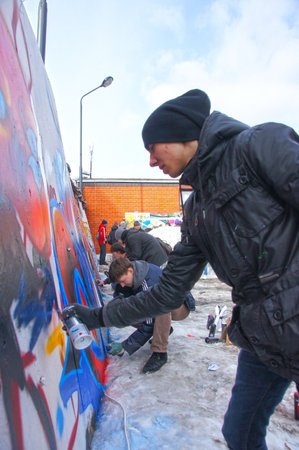 MOSCOW - MARCH 17:  Participants of competition draw on a wall of graffiti at the first stage of city festival Graffiti jam. on MARCH 17, 2012 in Moscow, Design factory Bottle.のeditorial素材