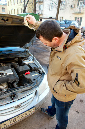 15.11.2012 Moscow. The driver examines the drive of the broken car.のeditorial素材