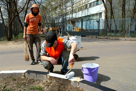 26.04.2012 Moscow. Painting of a road border.のeditorial素材