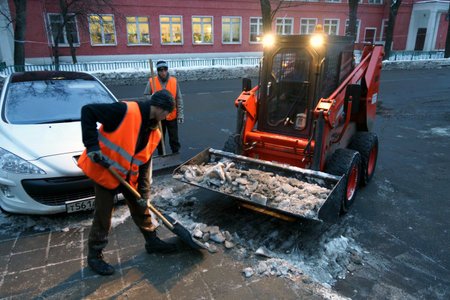 09.12.2012 Moscow. Snow cleaning in the evening.