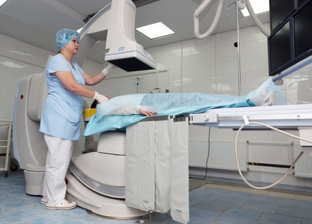 MOSCOW, RUSSIA - November 09, 2012: The patient before the operation on an x-ray machine. The endovascular surgery room in the city clinical hospital in Moscow.のeditorial素材