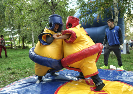 MOSCOW, RUSSIA - September 06, 2014:Boys in sumo suits are struggling. City Day celebrations in Moscow.のeditorial素材