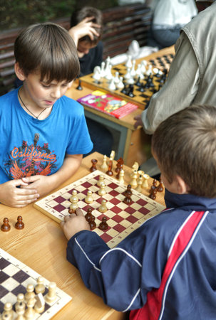 MOSCOW, RUSSIA - September 06, 2014: Children play chess. City Day celebrations in Moscow.のeditorial素材
