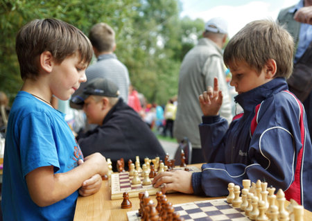MOSCOW, RUSSIA - September 06, 2014: Children play chess. City Day celebrations in Moscow.のeditorial素材