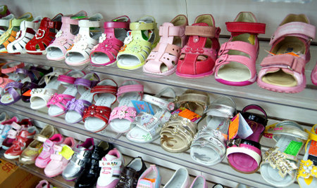 MOSCOW, RUSSIA - SEPTEMBER , 2011: Showcase with women's shoes and children's sandals. Shoe store in Moscow.のeditorial素材