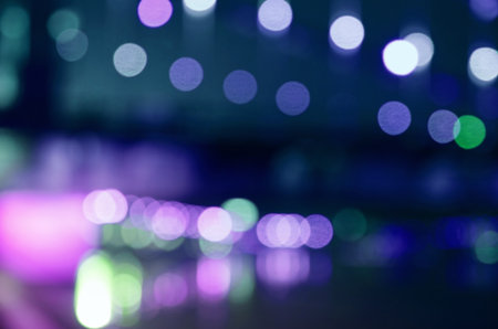 Light, bright spots, glare on a blue, purple blurred space.の写真素材