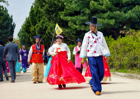 Seoul, South Korea - April 2018: People in national Korean clothes, walk around the city.のeditorial素材