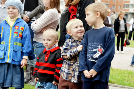MOSCOW, RUSSIA - May 2017: Three brothers are watching childrens show, at the festival of spring.のeditorial素材