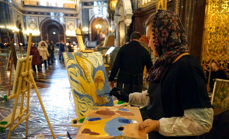 MOSCOW, RUSSIA - OCTOBER, 2018: A woman draws an angel in the Cathedral of Christ the Savior.のeditorial素材