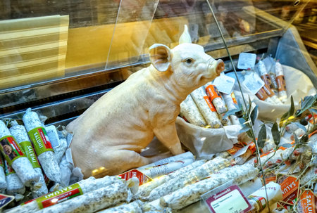 MOSCOW, RUSSIA - FEBRUARY, 2018: A copy of a young pig, pork sausage, on the counter of a butcher shop.のeditorial素材