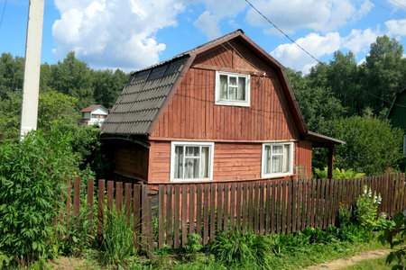 Moscow, Russia - JUNE, 2017: Wooden house, cottage in the suburbs. Summer, blue sky.のeditorial素材
