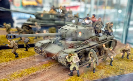 MOSCOW - MARCH, 2018: T34 tank model, a group of soldiers. Showcase with old toys in a retro toy store.のeditorial素材