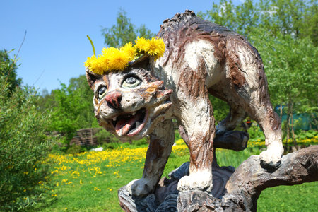 Mytishchi, Russia - September 2016: Magic crazy funny cat. Small fabulous skulpture in the city park.のeditorial素材