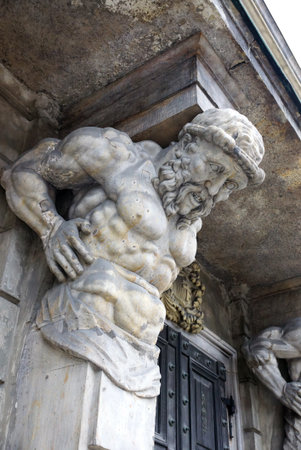 Warsaw - September 2013: Atlas supporting a balcony. The central part of the city.のeditorial素材