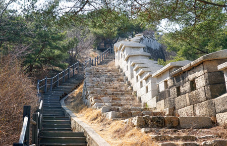 Seoul, March - 2019: Stone stairway trail along the Seoul Fortress Wall.  Inwangsan Mountain.