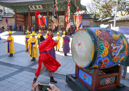 Seoul, March - 2019: Guard change ceremony at the Deoksugung Royal Palace. The drummer beats the big drum.のeditorial素材
