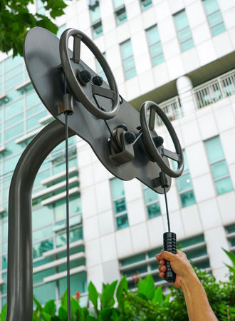 Sports simulator and a female hand, against the background of a modern office building.のeditorial素材