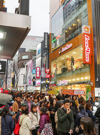 Seoul, Republic of Korea - August 2019: Crowds of people on the street, shops, outdoor advertising. Myeongdong Shopping Street.のeditorial素材