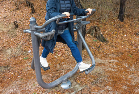 Woman in nature, training on a sports simulator.