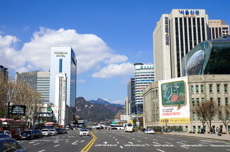 Seoul, Republic of Korea - March 2019: City view. City center with office buildings. Wide road, view of the mountain.のeditorial素材