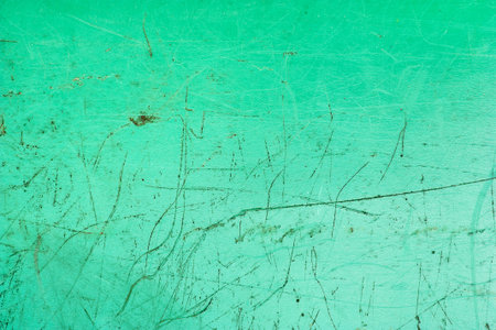 Scratched green plastic texture for backgroundsの写真素材
