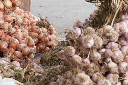 Garlic and onions are piled on disposal.Thailandの写真素材