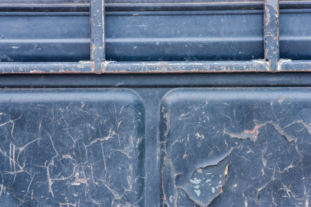 Sheet metal blue with a cracked, background.