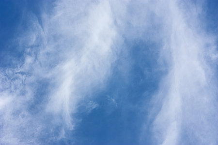 white fluffy clouds in the blue sky, background