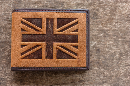Leather wallets British flag pattern Wood background