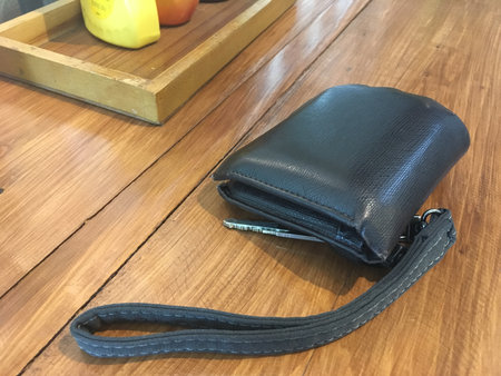 wallet and key on the restaurant desk