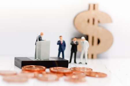 Miniature businessman stand talking on the podium, Business and finance investment concept
の写真素材