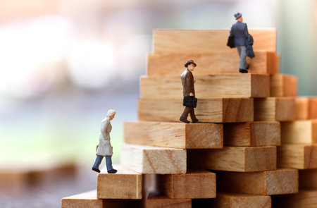 Miniature people walking on step of Wood block stack.  growth in business concept.の写真素材