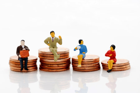 Miniature people: Business team sitting on coins stack, Eduation and business concept.の写真素材