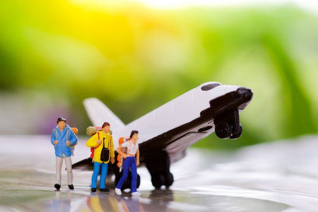 Miniature backpacker with airplane, travel or business concept.
の写真素材
