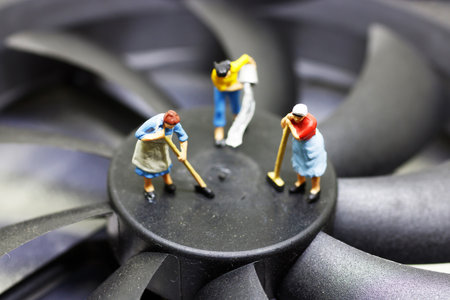 Miniature women cleaning propeller computer. Concept of cleaning day.
の写真素材