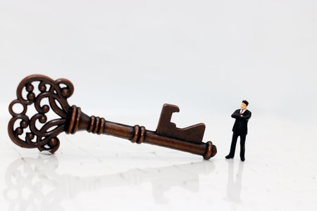 Miniature business people with the key success.の写真素材
