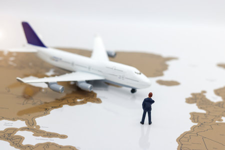 Miniature people: Business team standing in front of airplane. Business Concept.の写真素材