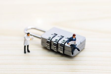 Miniature people are decrypting unlock padlock, Decrypt the key. concept for data security breach,...