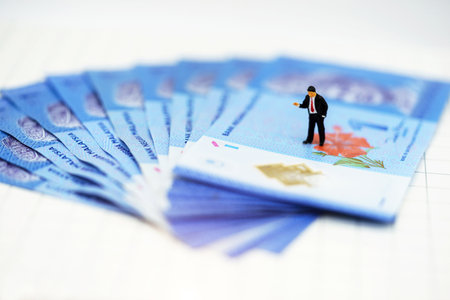 Miniature people:  Businessmen standing with money, Finance, investment and growth in business concept.の写真素材