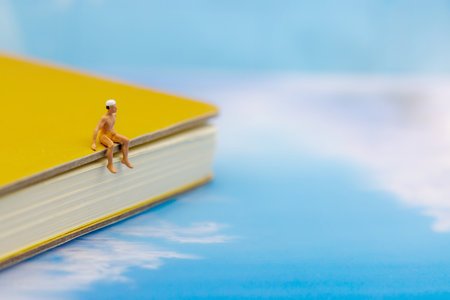Miniature people: Tourists Sunbathing on the beach. Concept of traveling, business concept.の写真素材