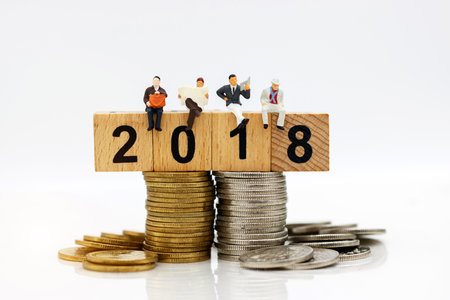 Miniature people:  Businessmen standing with coins stack, Finance, investment and growth in business...