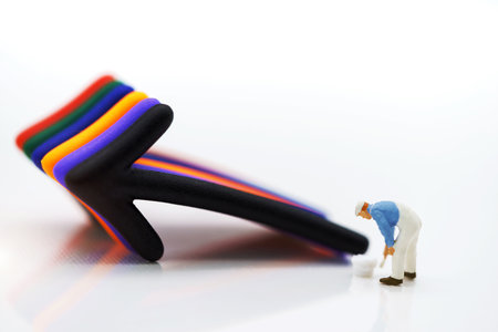 Miniature people standing whit arrow pathway choice. Concepts of problem solving, challenge and Unexpected solutions.の写真素材