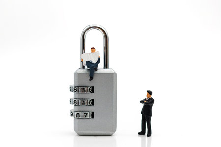 Miniature people are decrypting unlock padlock, Decrypt the key. concept for data security breach,...