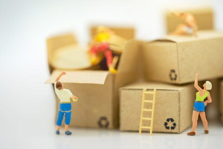 Miniature people climbing golden coins achieving top. Success, Finance, investment and growth in business concept.の写真素材