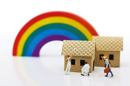 Mainature people: Workers stand at home to plan building.の写真素材