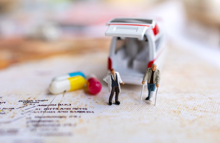 Miniature people : Doctor and patient standing with Capsule and Ambulance. Healthcare and medical...