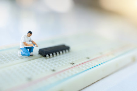 Miniature people searching or checking for bugs and issue on microchip, mainboard of computer....
