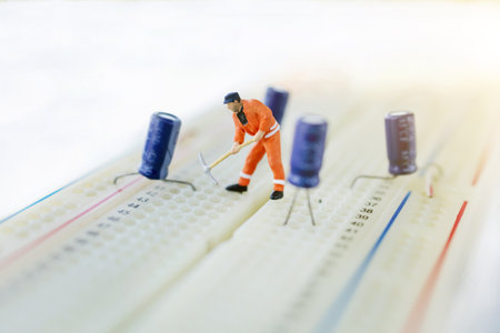 Miniature people searching or checking for bugs and issue on microchip, mainboard of computer. Vulnerability search and security system concept.の写真素材